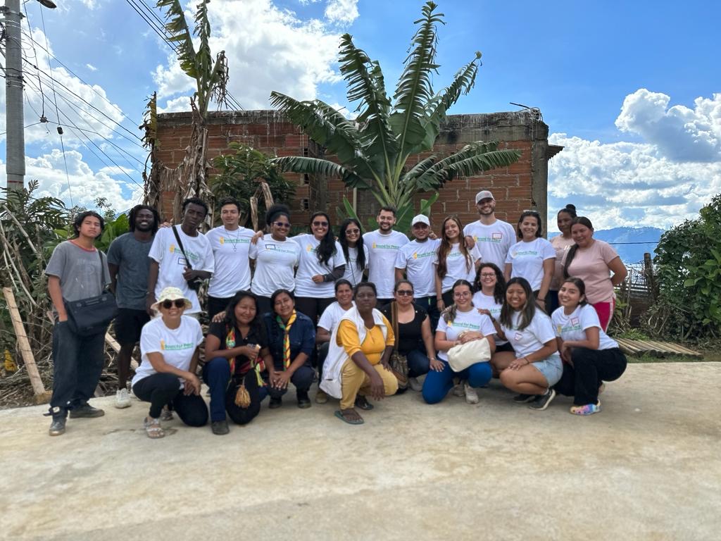 CBOB volunteer team with community members in Granizal, Medellin